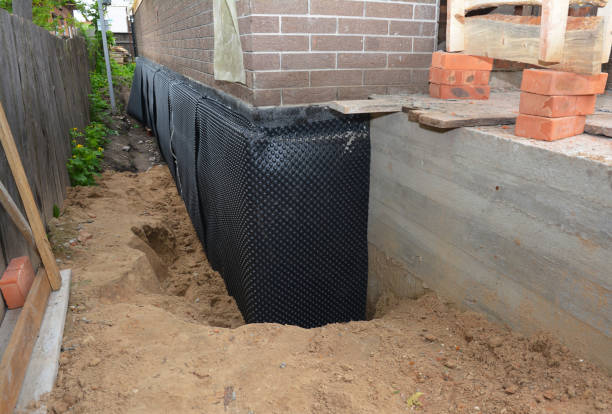 Happy homeowners after waterproofing job in Deer Lodge